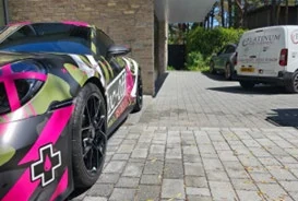 Colourful wrapped car receiving mobile care from Platinum Car Cleaning